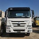What are the transportation and shipping options for purchased used heavy equipment?